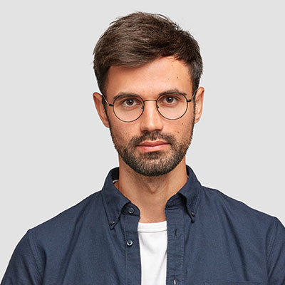 Professional man with glasses and a serious expression, representing expertise in cybersecurity and IT solutions for GetUK Support.